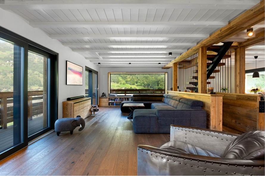 Open-plan living room with valley windows