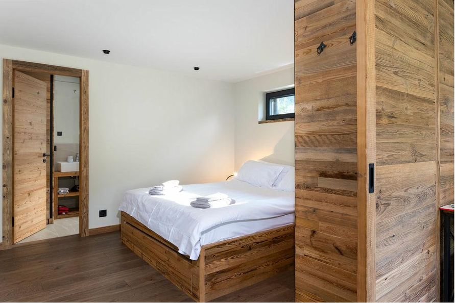 Studio Aigle double bedroom with reclaimed timber